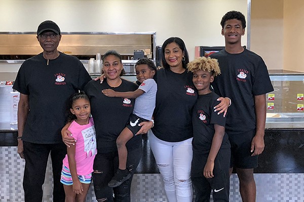 The Leeds Area Chamber of Commerce and the City of Leeds cut the ribbon at the Frozen Rooster located in the food court at the Outlet Shops of Grand River.