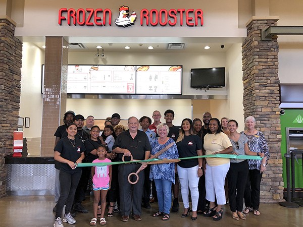The Leeds Area Chamber of Commerce and the City of Leeds cut the ribbon at the Frozen Rooster located in the food court at the Outlet Shops of Grand River.