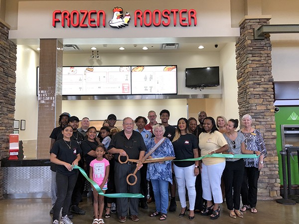 The Leeds Area Chamber of Commerce and the City of Leeds cut the ribbon at the Frozen Rooster located in the food court at the Outlet Shops of Grand River.