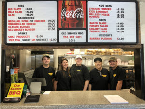 A great crowd joined to celebrate Old Smokey BBQ ribbon cutting with City of Leeds, Leeds Area Chamber of Commerce and business owners, Cody & Cory Price.