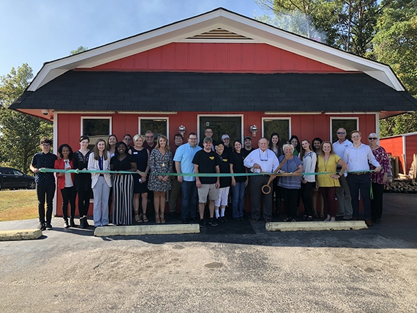 A great crowd joined to celebrate Old Smokey BBQ ribbon cutting with City of Leeds, Leeds Area Chamber of Commerce and business owners, Cody & Cory Price.