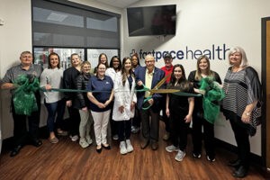 Fast Pace Health ribbon cutting with City of Leeds Leeds Mayor David Miller, Leeds Area Chamber of Commerce board members, Fast Pace staff