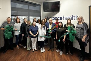 Fast Pace Health ribbon cutting with City of Leeds Leeds Mayor David Miller, Leeds Area Chamber of Commerce board members, Fast Pace staff